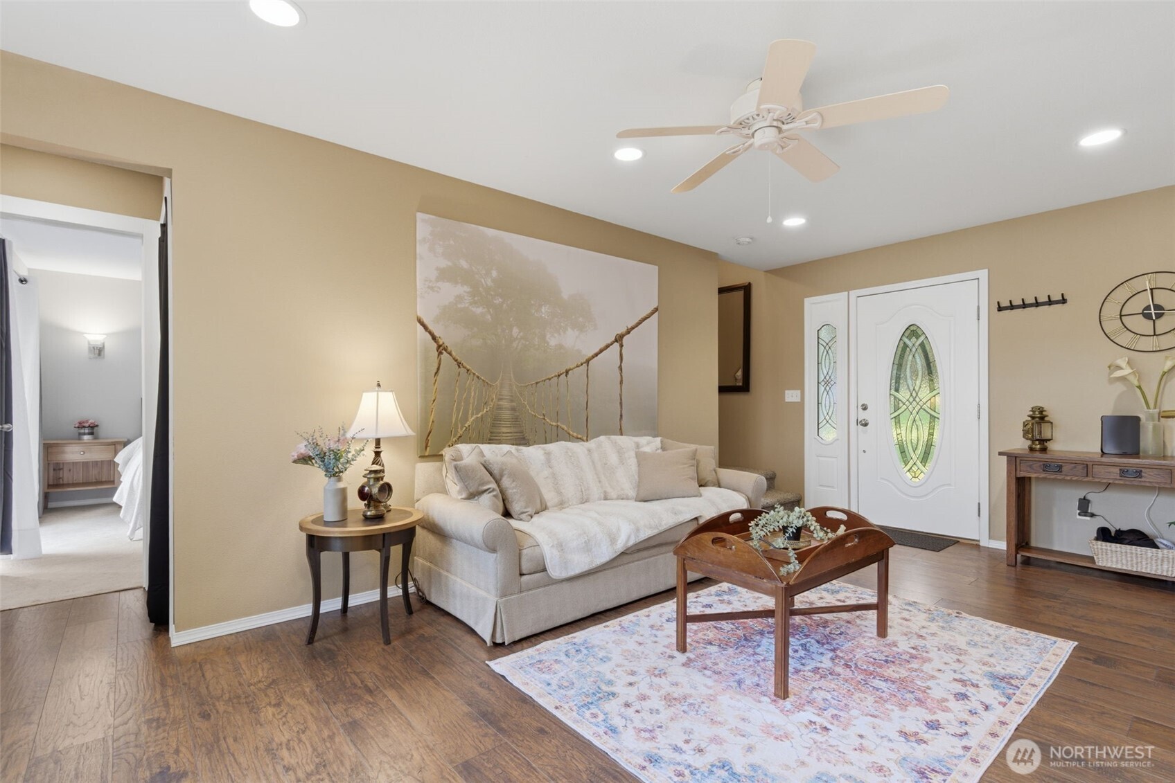 6971 Northeast Tahuya Blacksmith Road Belfair, WA 98528 - Photo 19 of 38 a living room with furniture and wooden floor
