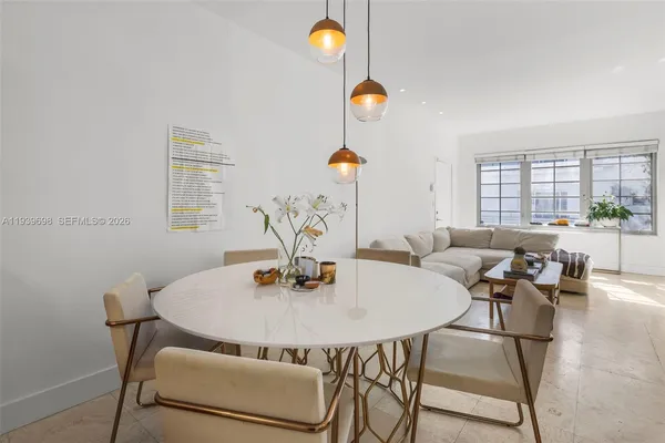 a dining room with a table and chairs