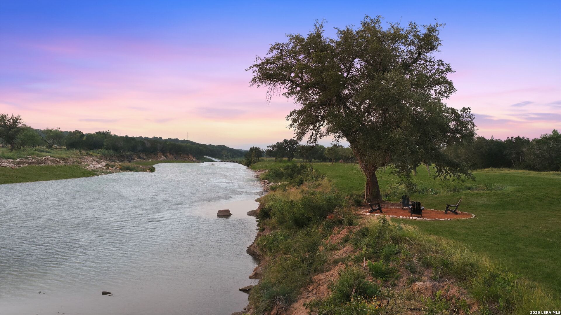 3402 Mormon Mill Road Marble Falls, TX 78654 - Photo 3 of 29 a view of a lake with a yard