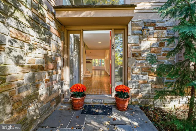 a house with a yard and large trees