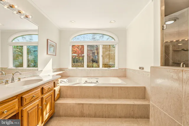 a view of hallway with wooden floor and stairs