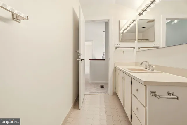 a view of a bedroom with wooden floor and closet