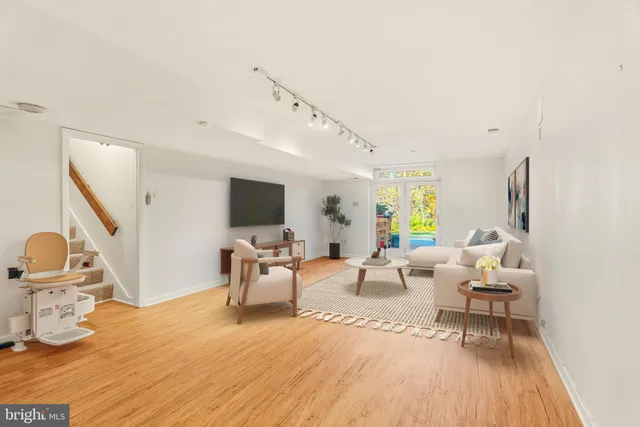 a view of empty room with wooden floor and cabinet