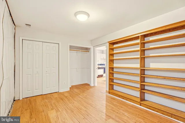 a backyard of a house with a yard and outdoor seating