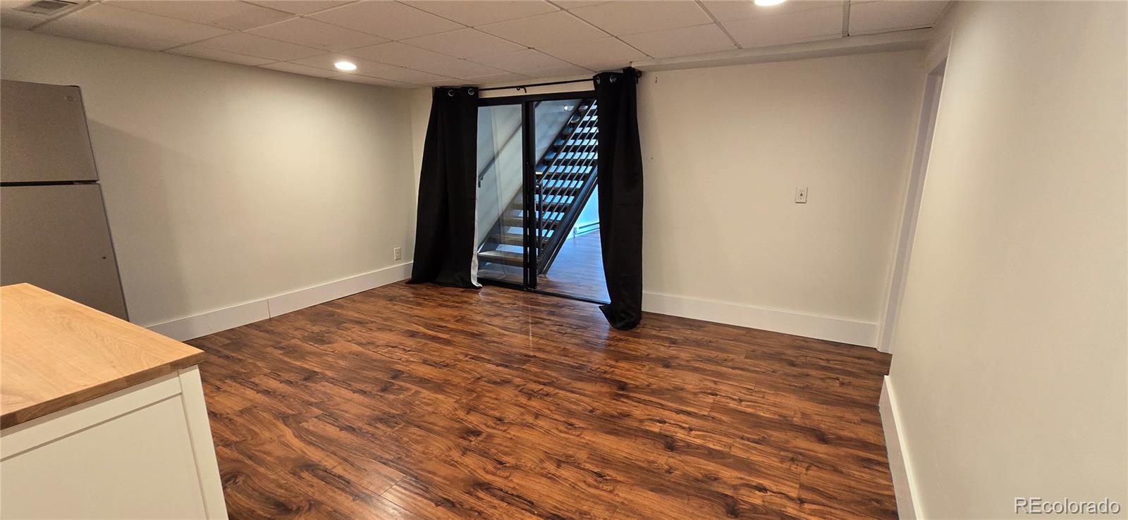 2940 19th Street Boulder, CO 80304 - Photo 2 of 10 a view of an empty room with wooden floor and white doors