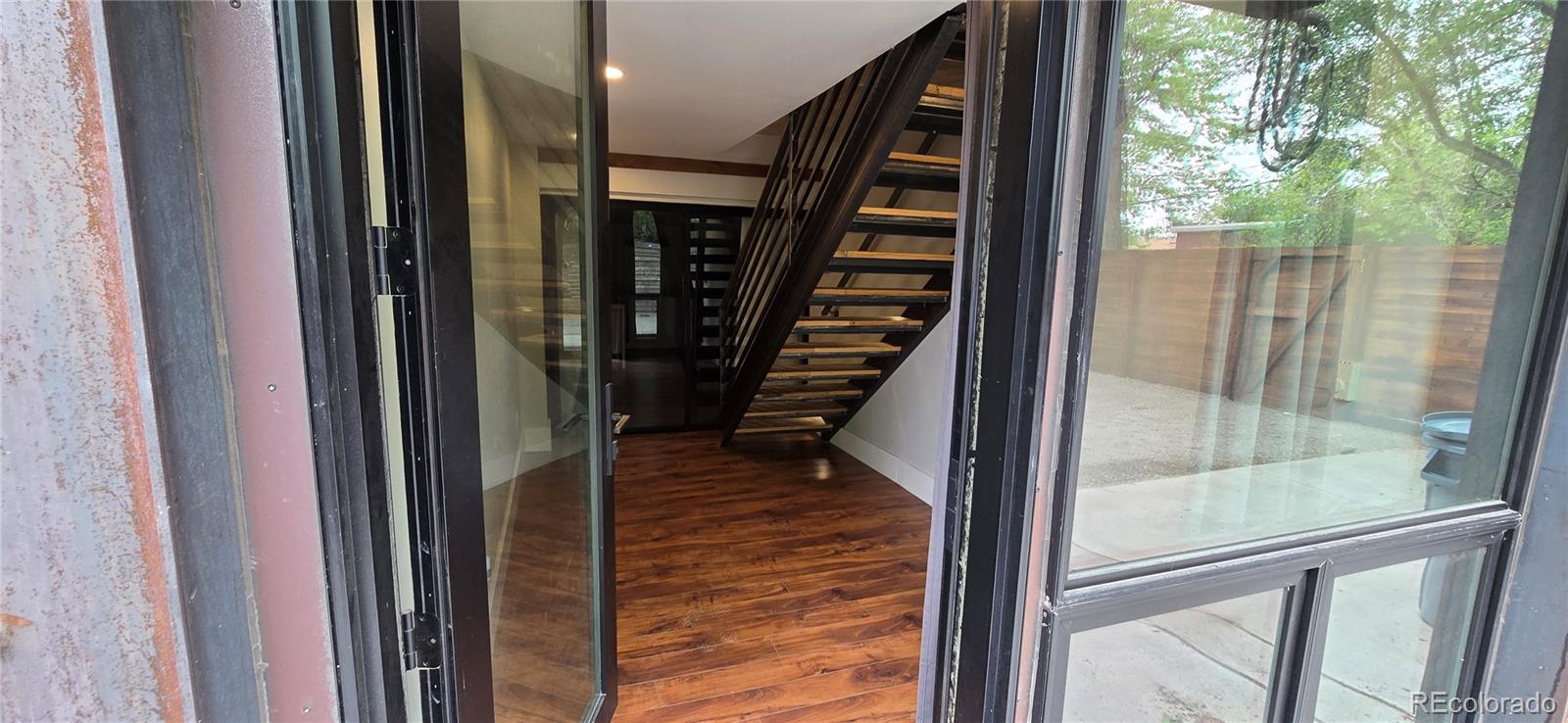 2940 19th Street Boulder, CO 80304 - Photo 9 of 10 a view of entryway with wooden floor and stairs