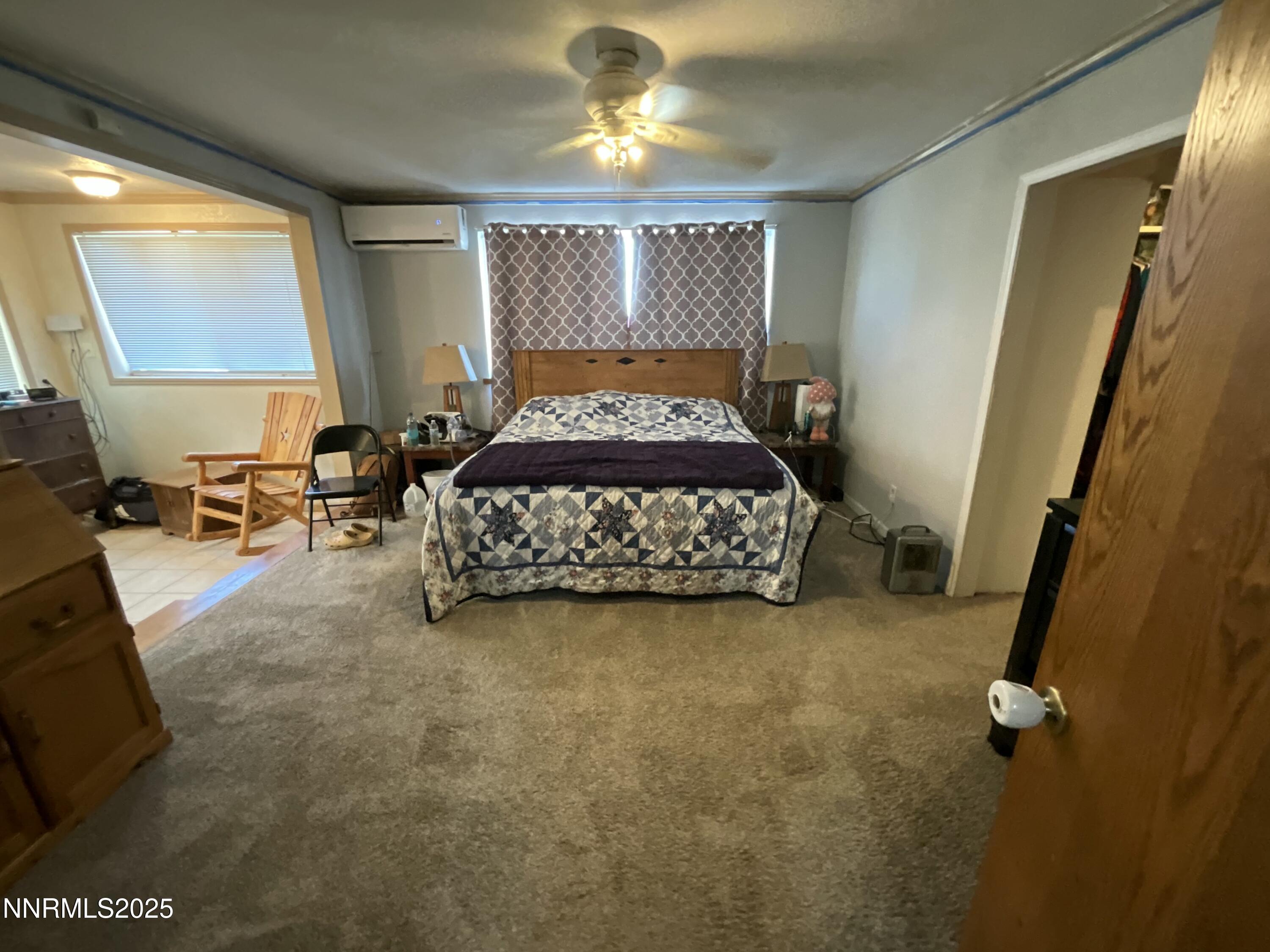 151 Bateman Street Austin, NV 89310 - Photo 15 of 33 a bed sitting in a room next to a window