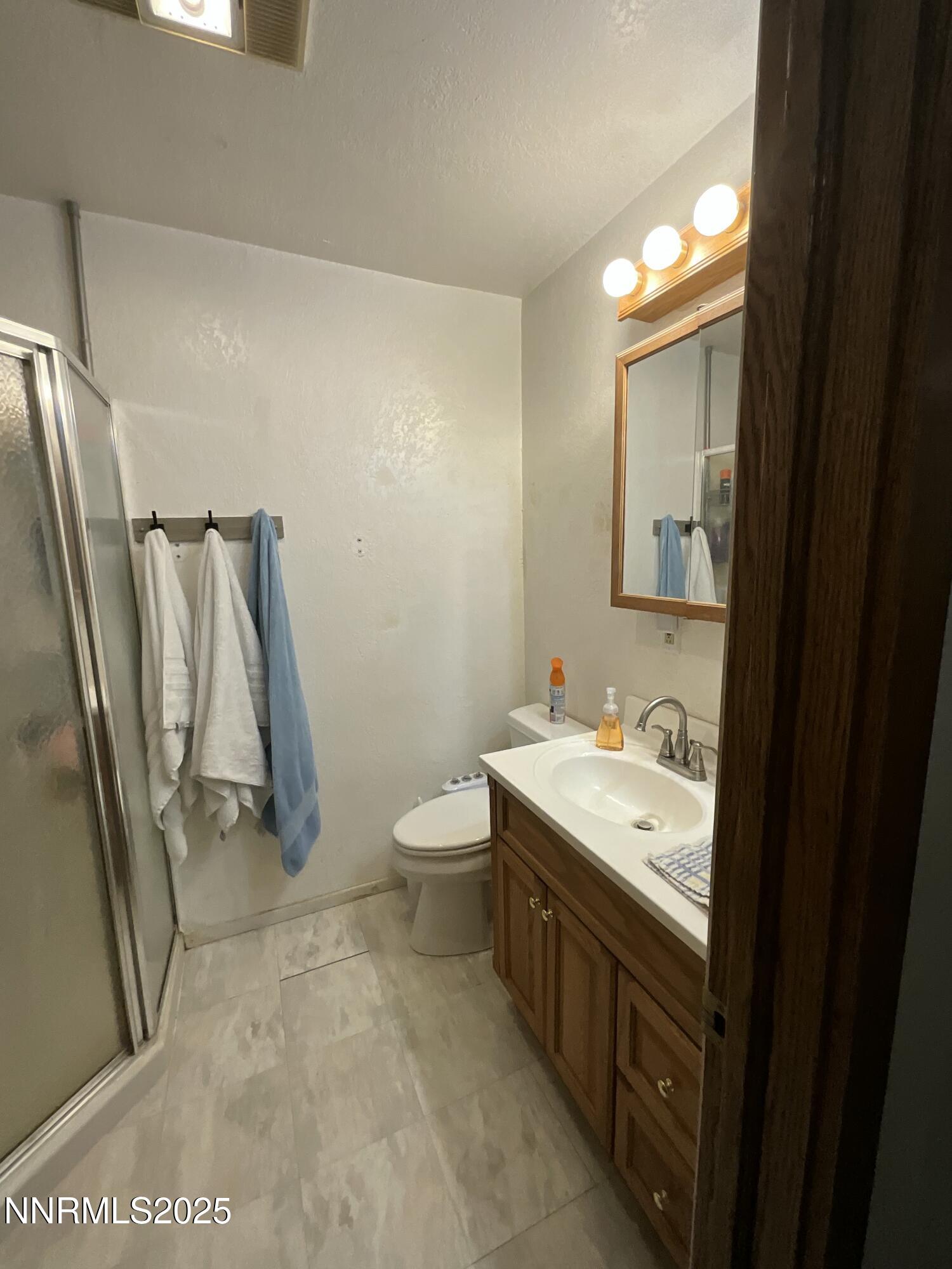 151 Bateman Street Austin, NV 89310 - Photo 17 of 33 a bathroom with a sink a toilet and a mirror