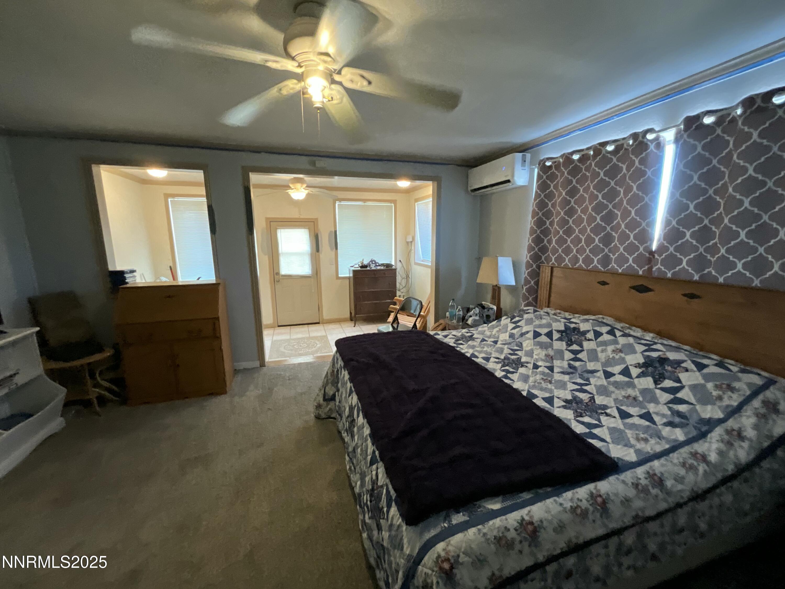 151 Bateman Street Austin, NV 89310 - Photo 20 of 33 a living room with a couch and a chandelier