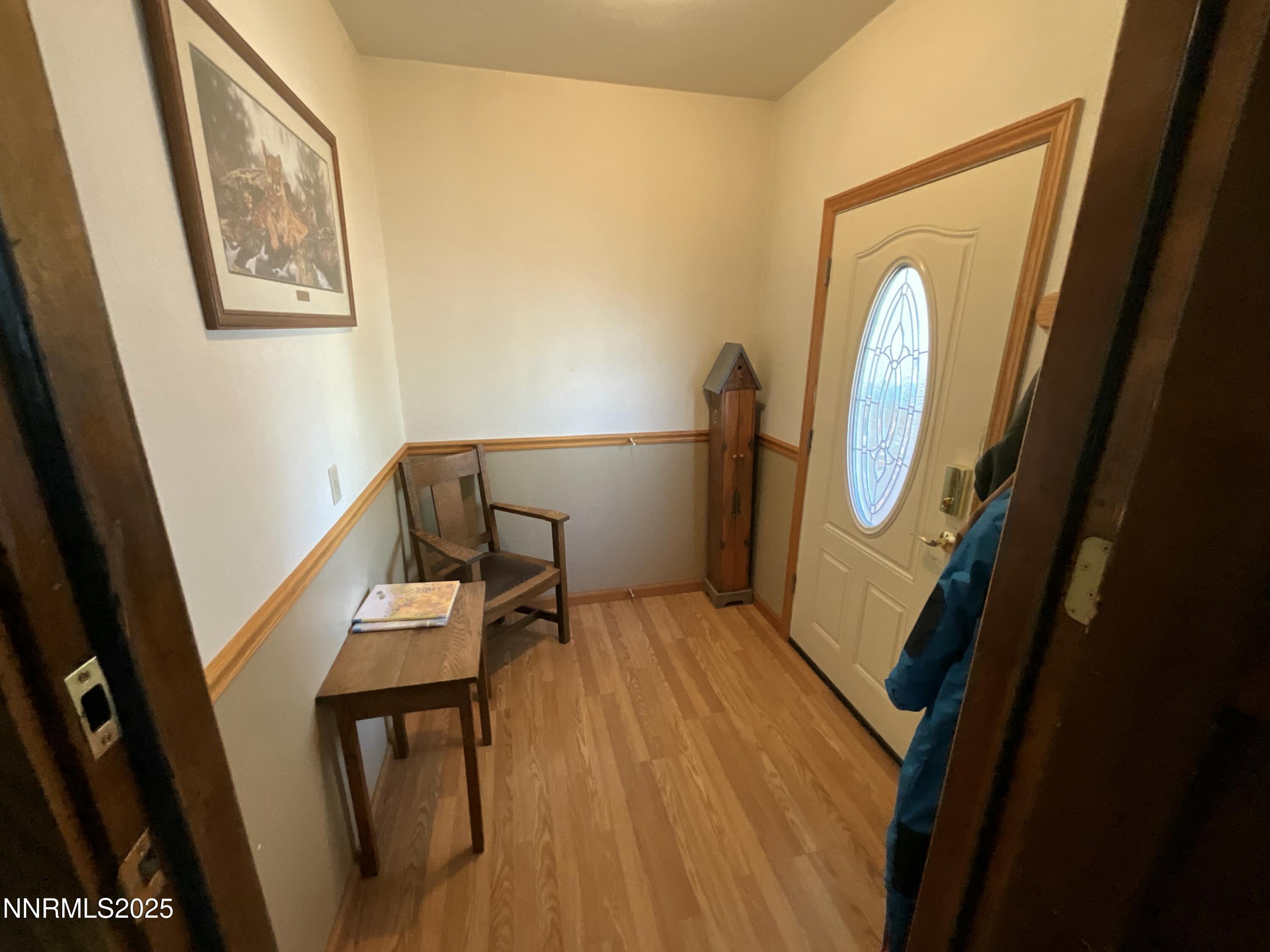151 Bateman Street Austin, NV 89310 - Photo 21 of 33 a view of a hallway with wooden floor and furniture