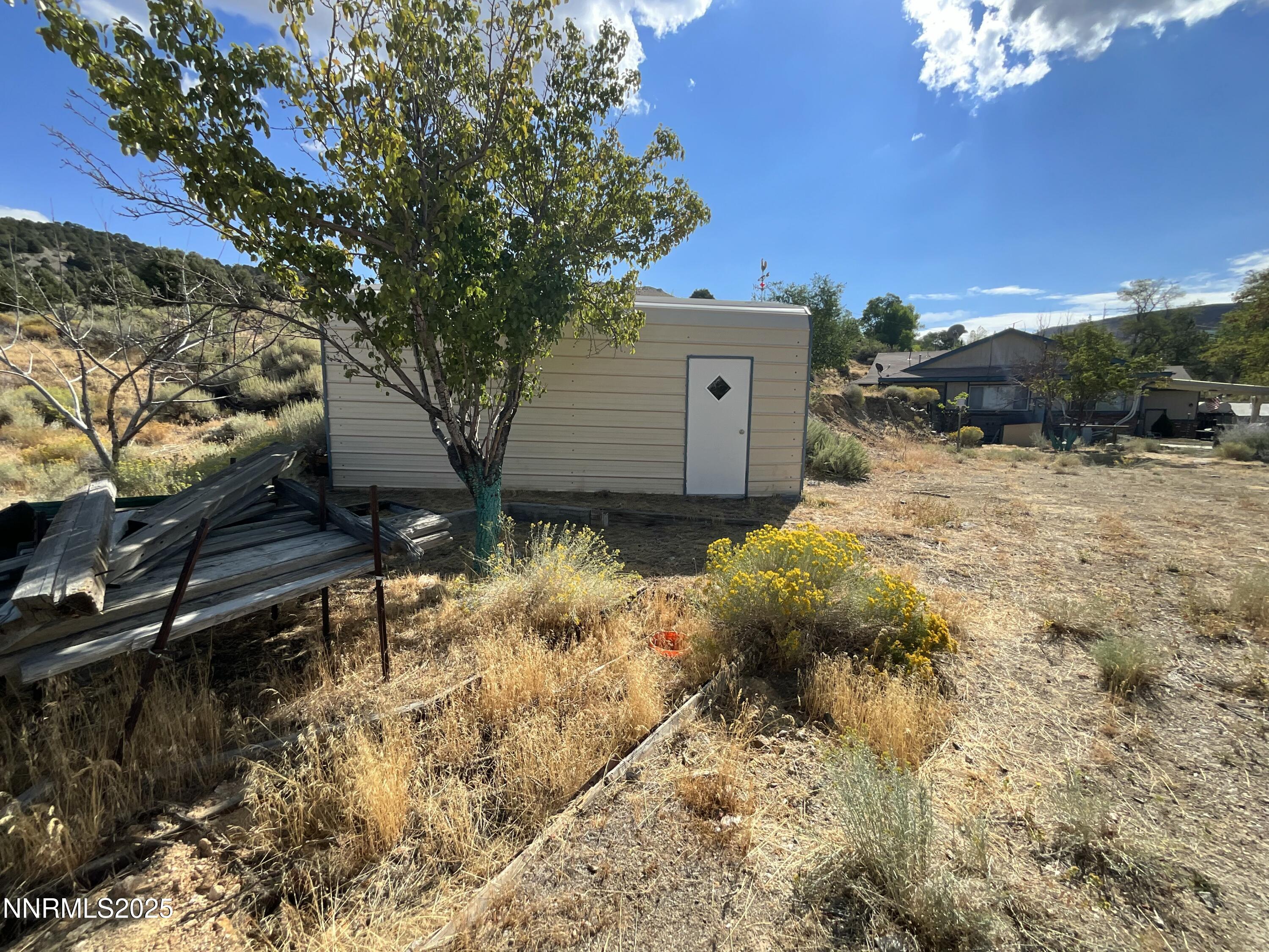 151 Bateman Street Austin, NV 89310 - Photo 27 of 33 a view of backyard with outdoor seating and green space