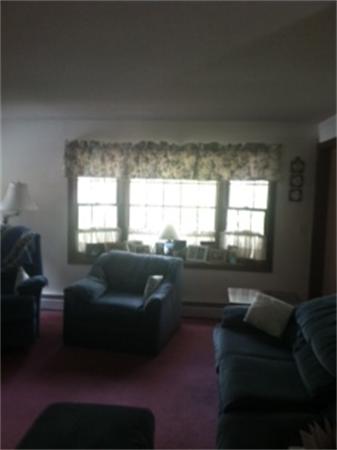 19 Randall Road Rochester, MA 02770 - Photo 12 of 19 a living room with furniture and a large window