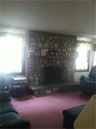 19 Randall Road Rochester, MA 02770 - Photo 13 of 19 a living room with furniture and a fireplace