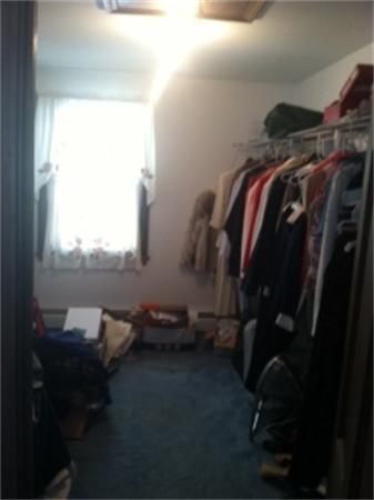 19 Randall Road Rochester, MA 02770 - Photo 15 of 19 a view of walk in closet with clothes and shoes