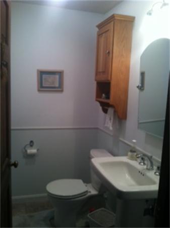 19 Randall Road Rochester, MA 02770 - Photo 6 of 19 a bathroom with a toilet sink and mirror