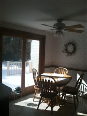 19 Randall Road Rochester, MA 02770 - Photo 7 of 19 a view of a dining room with furniture and window