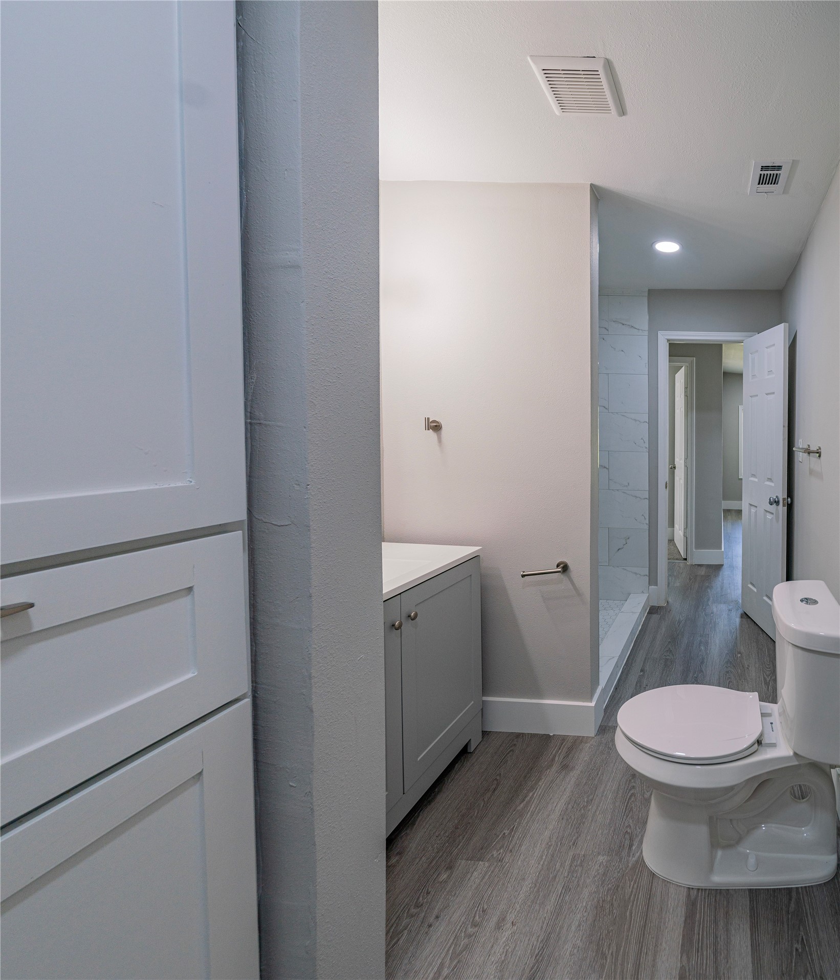 5718 Cherry Street Houston, TX 77026 - Photo 13 of 35 a white toilet sitting next to a bathroom sink