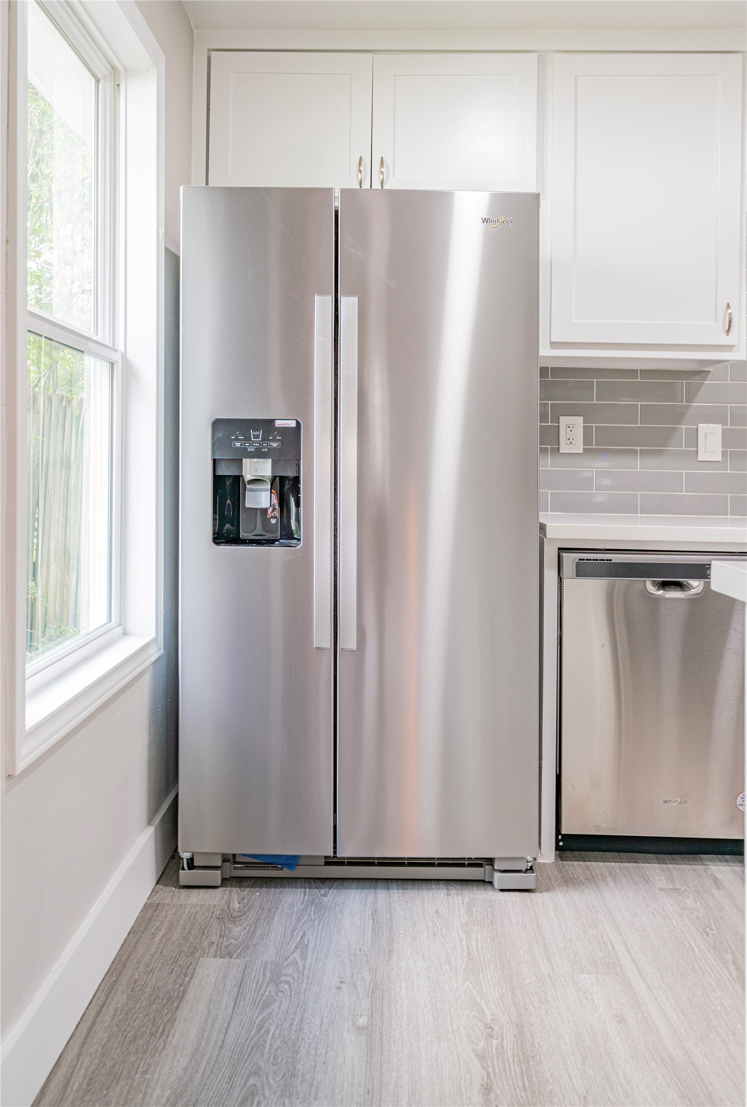 5718 Cherry Street Houston, TX 77026 - Photo 18 of 35 a view of a refrigerator in kitchen and white cabinets