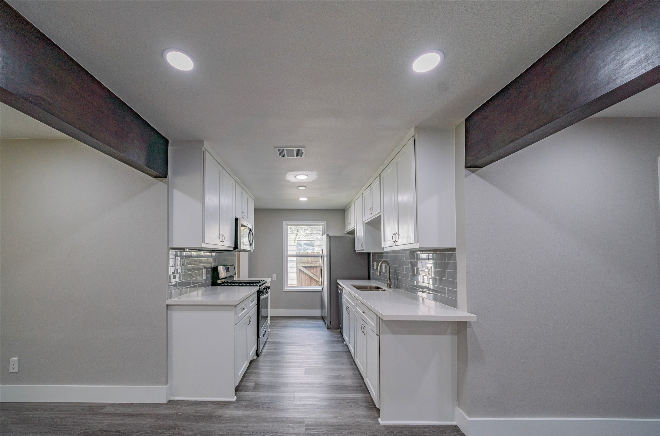 5718 Cherry Street Houston, TX 77026 - Photo 19 of 35 a kitchen with cabinets and appliances