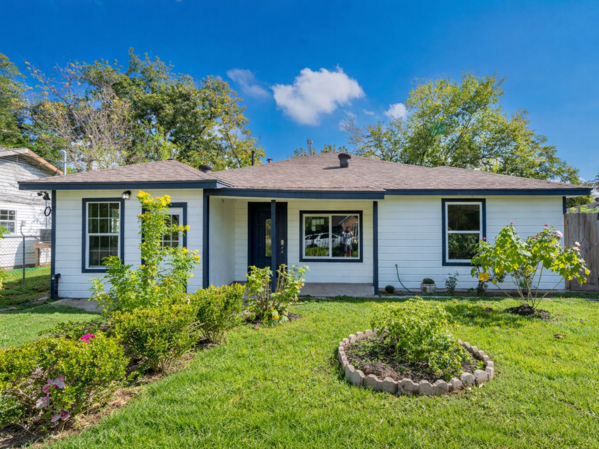 5718 Cherry Street Houston, TX 77026 - Photo 2 of 35 a front view of a house with a garden