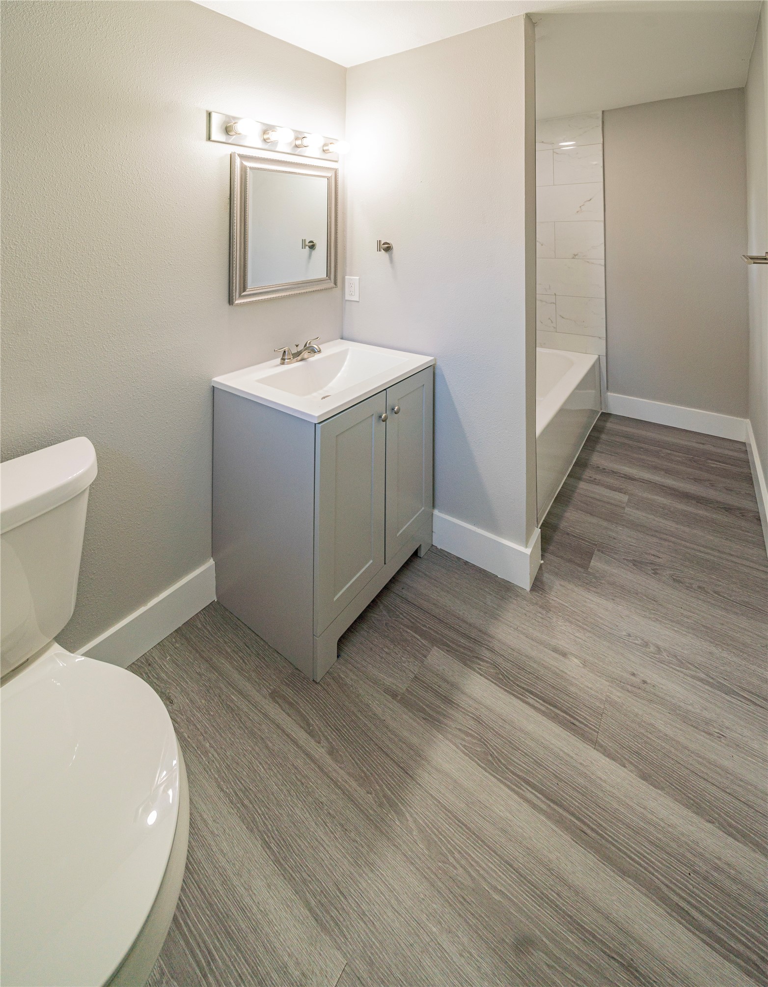 5718 Cherry Street Houston, TX 77026 - Photo 26 of 35 a bathroom with a toilet sink and mirror