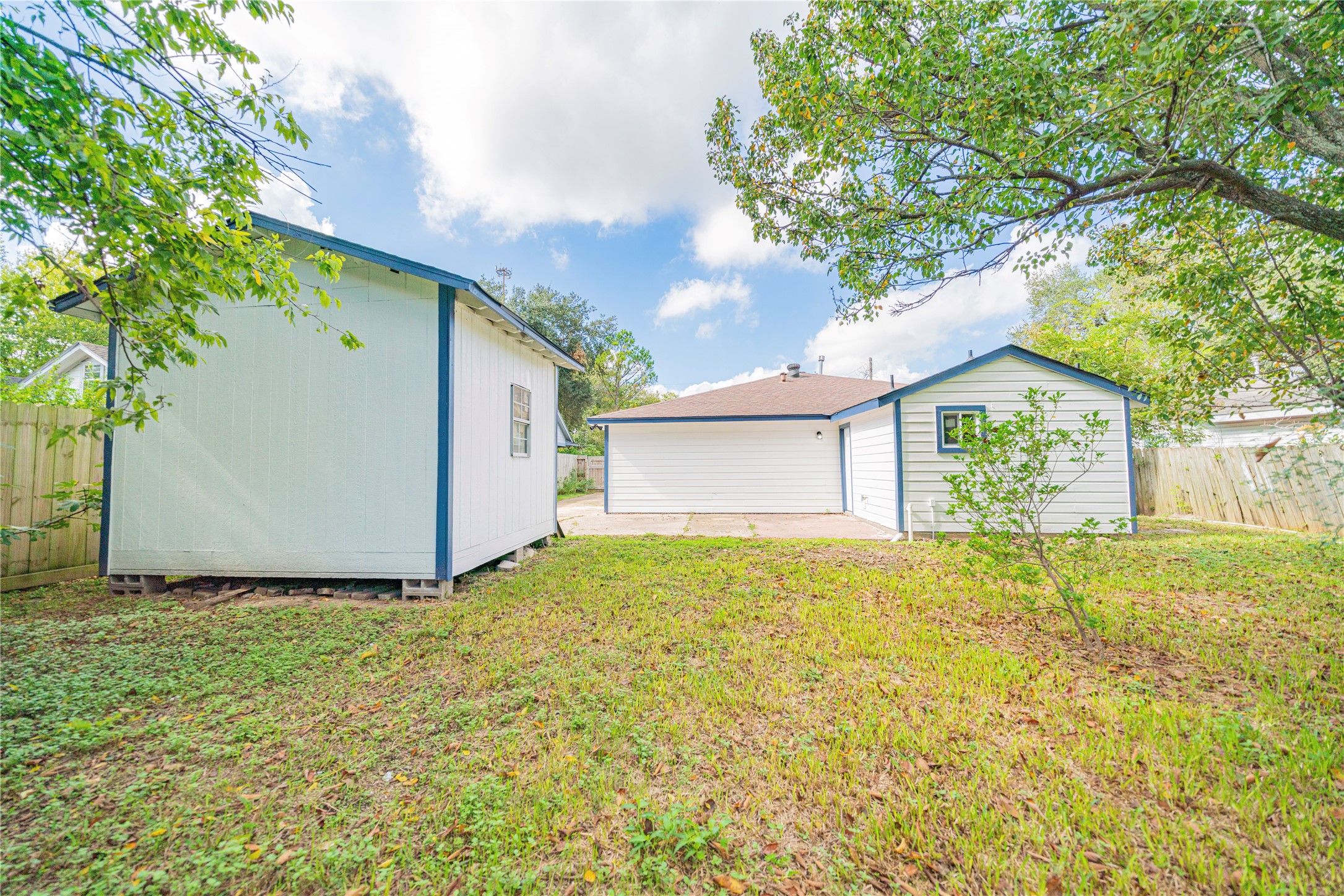 5718 Cherry Street Houston, TX 77026 - Photo 34 of 35 a view of a house with a large tree and a yard