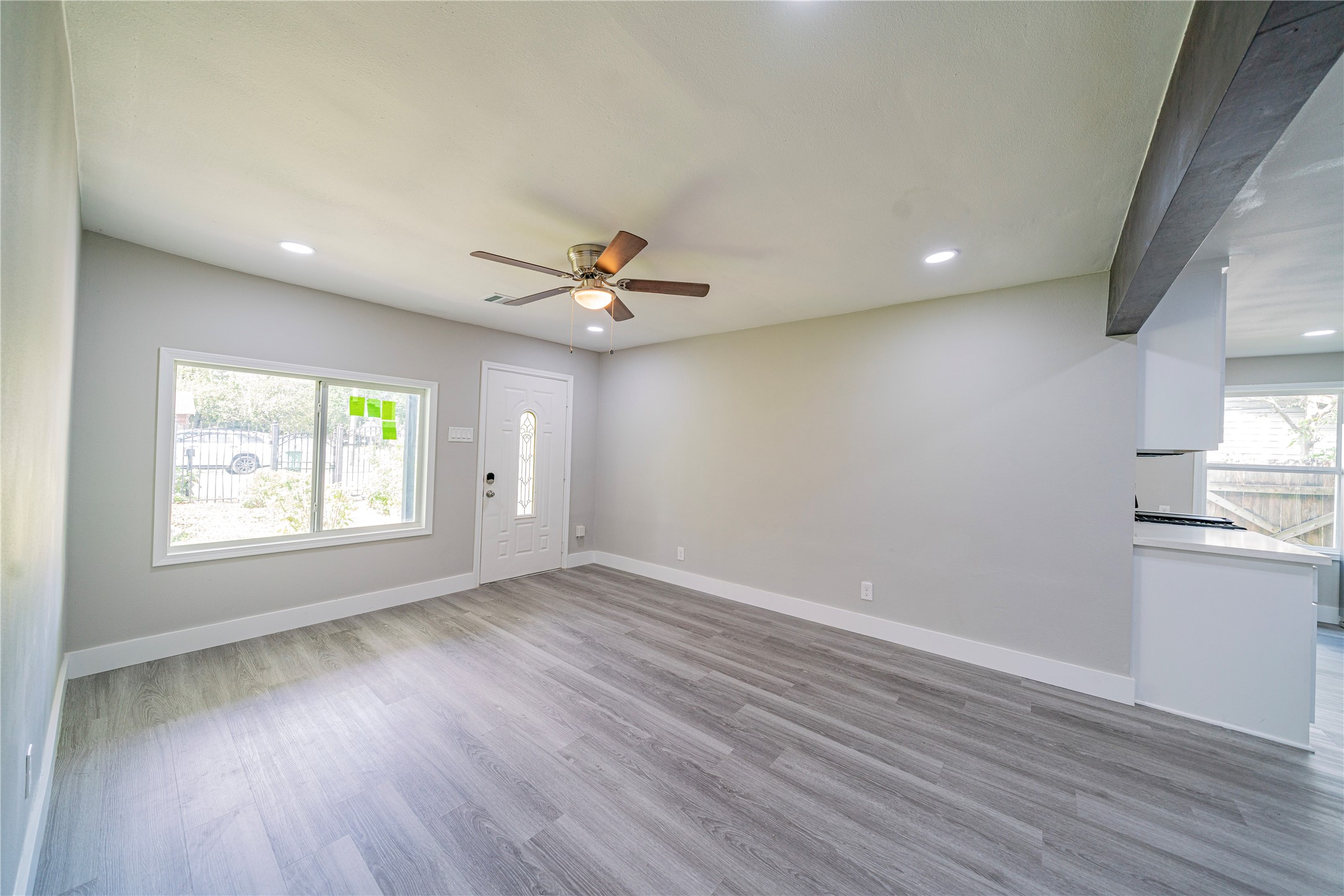 5718 Cherry Street Houston, TX 77026 - Photo 7 of 35 an empty room with wooden floor and windows