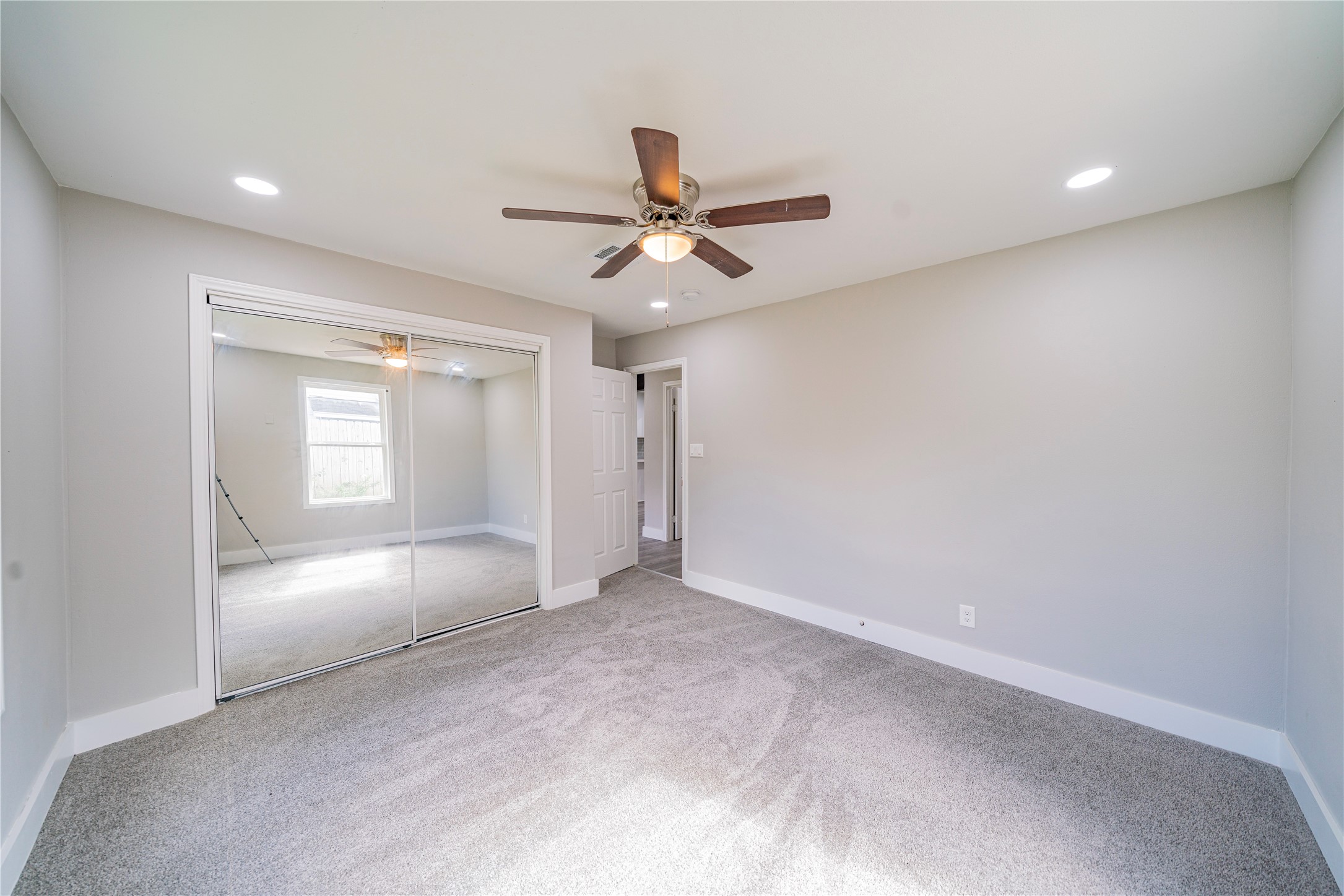 5718 Cherry Street Houston, TX 77026 - Photo 10 of 35 wooden floor in an empty room with a window