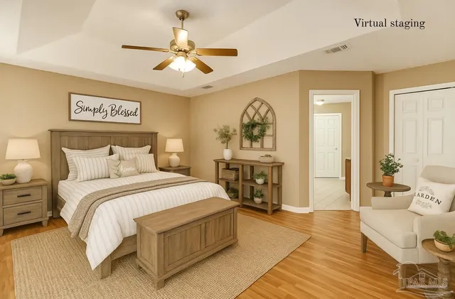 a spacious bedroom with a bed and a chandelier