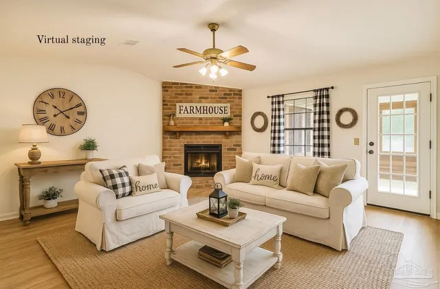 a living room with furniture a fireplace and a large window