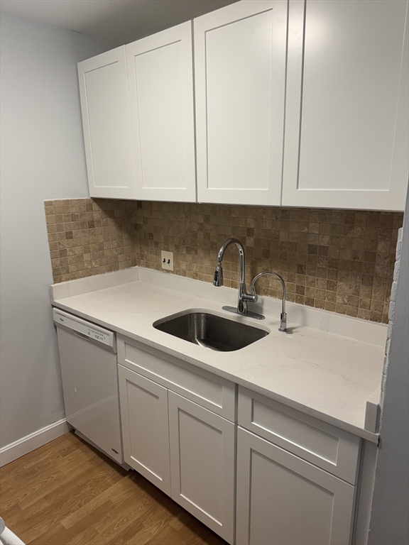 144 Kenrick Street, Unit 37 Boston, MA 02135 - Photo 1 of 12 a view of a sink and cabinets