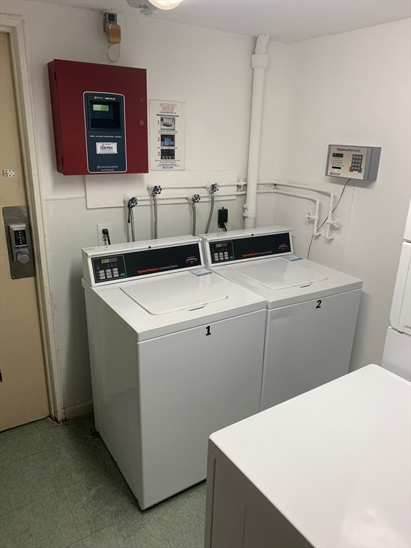144 Kenrick Street, Unit 37 Boston, MA 02135 - Photo 11 of 12 a utility room with dryer and washer
