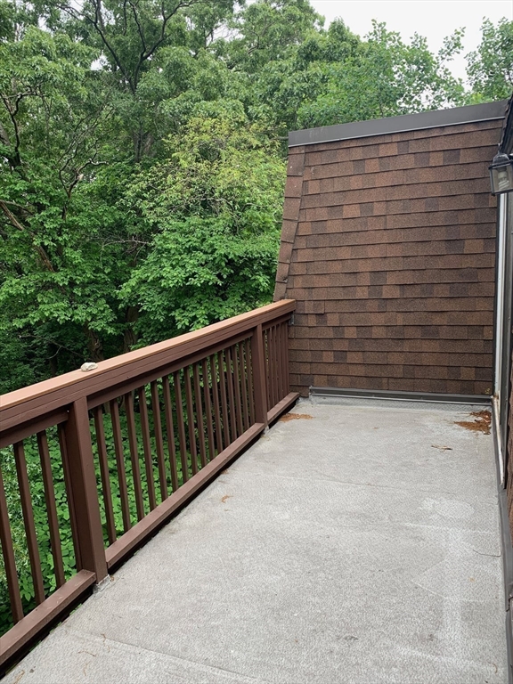 144 Kenrick Street, Unit 37 Boston, MA 02135 - Photo 6 of 12 a view of wooden balcony