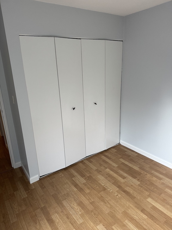 144 Kenrick Street, Unit 37 Boston, MA 02135 - Photo 8 of 12 a view of an empty room