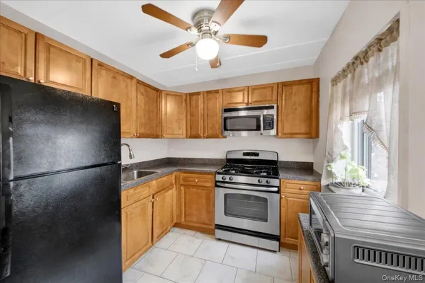 a kitchen with a refrigerator sink and stove