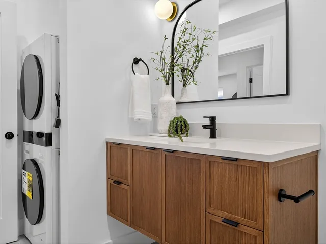 a bathroom with a sink and mirror
