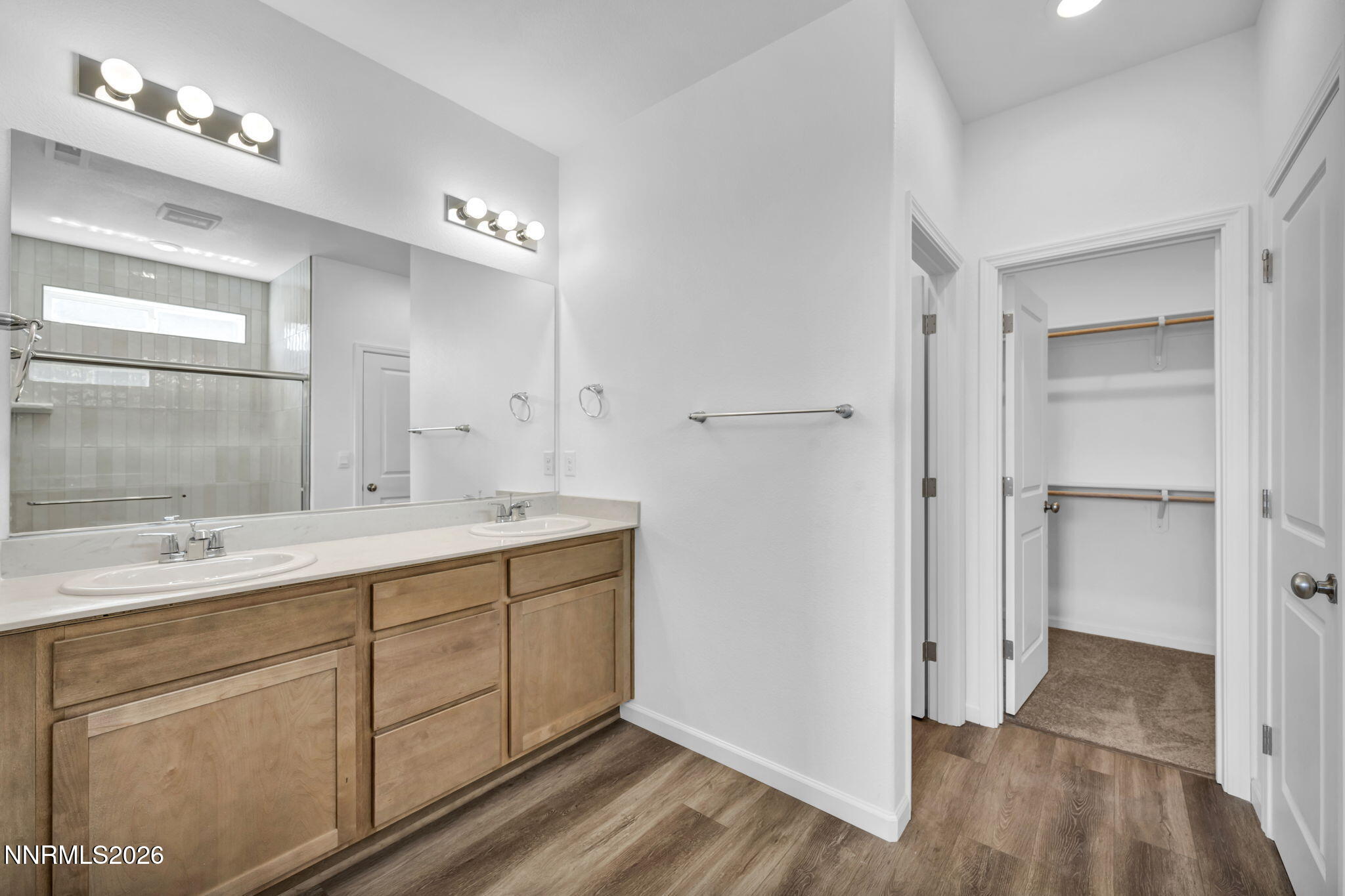 6676 Morgan Mill Road, Unit HOMESITE 14 Carson City, NV 89701 - Photo 16 of 24 a spacious bathroom with a double vanity sink a mirror and a shower