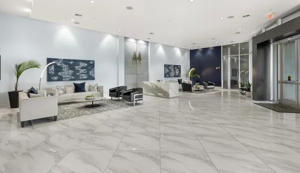 a work room with furniture and a flat screen tv