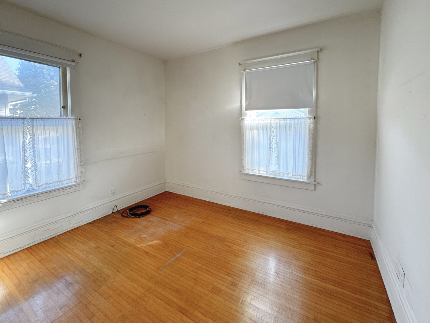 333 Elm Street Elgin, IL 60123 - Photo 19 of 25 a view of empty room with wooden floor and fan