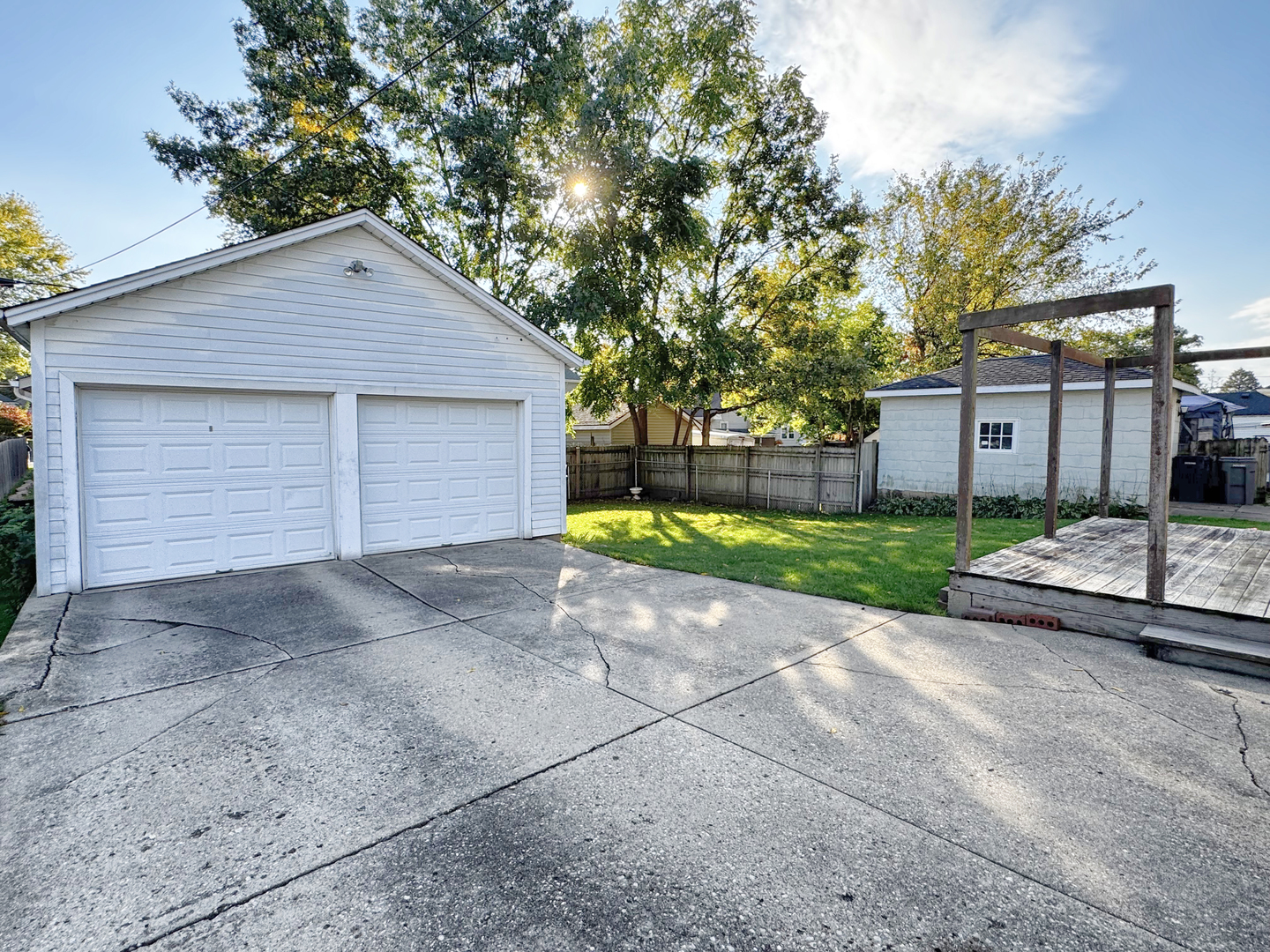 333 Elm Street Elgin, IL 60123 - Photo 24 of 25 a view of a house with a yard and large tree