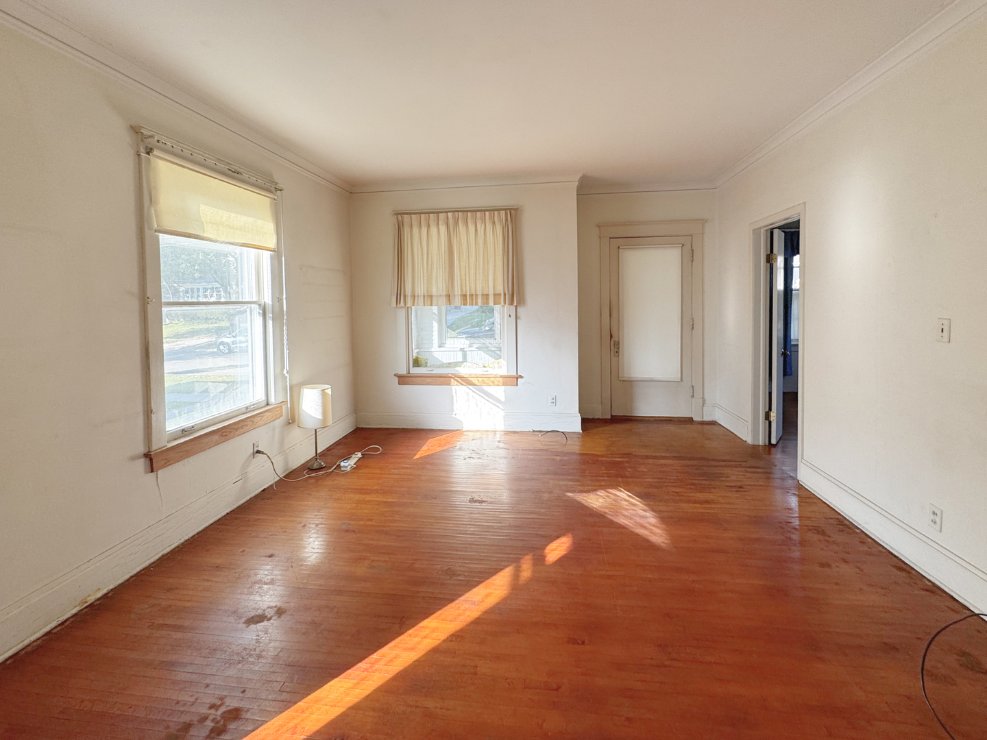 333 Elm Street Elgin, IL 60123 - Photo 4 of 25 a view of empty room with wooden floor and fan