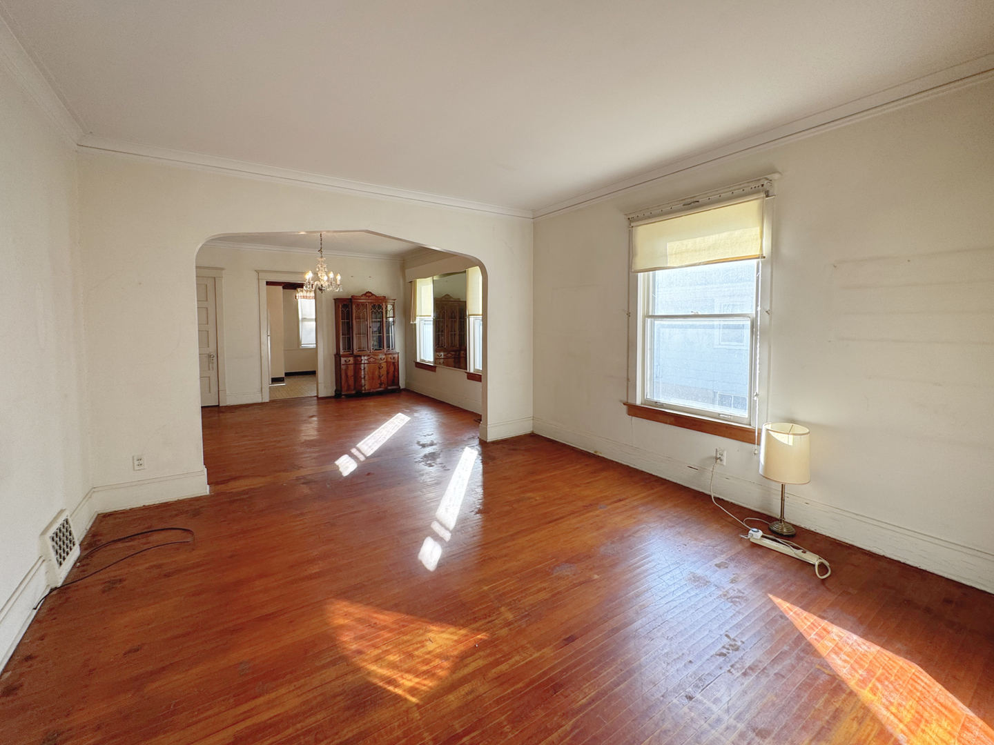 333 Elm Street Elgin, IL 60123 - Photo 5 of 25 an empty room with wooden floor and windows