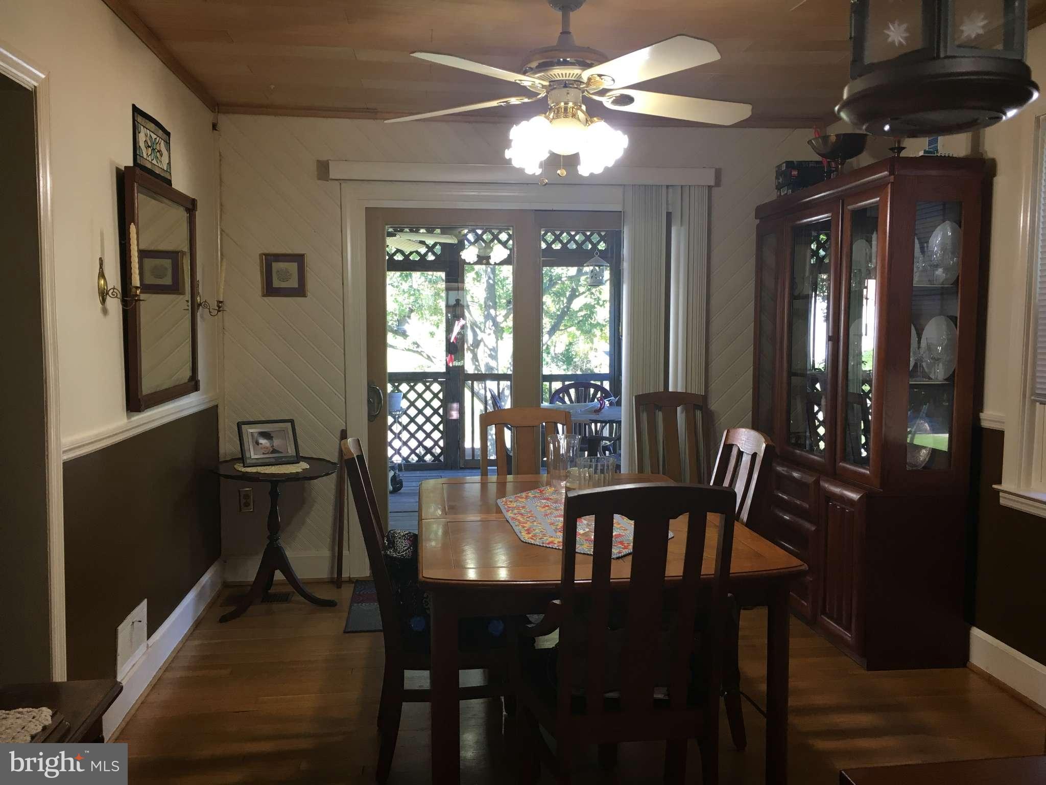 6010 Falkirk Road Baltimore, MD 21239 - Photo 14 of 30 a view of a dining room with furniture window and outside view