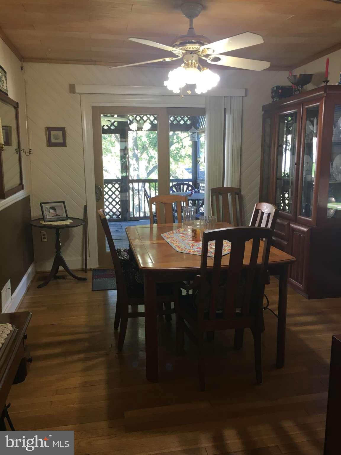 6010 Falkirk Road Baltimore, MD 21239 - Photo 20 of 30 a view of a dining room with furniture window and wooden floor