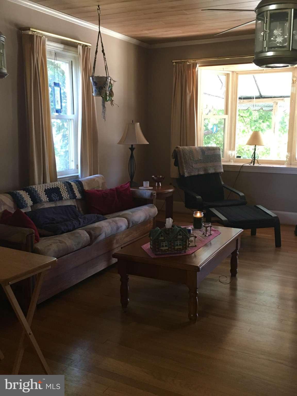 6010 Falkirk Road Baltimore, MD 21239 - Photo 25 of 30 a living room with furniture and a large window