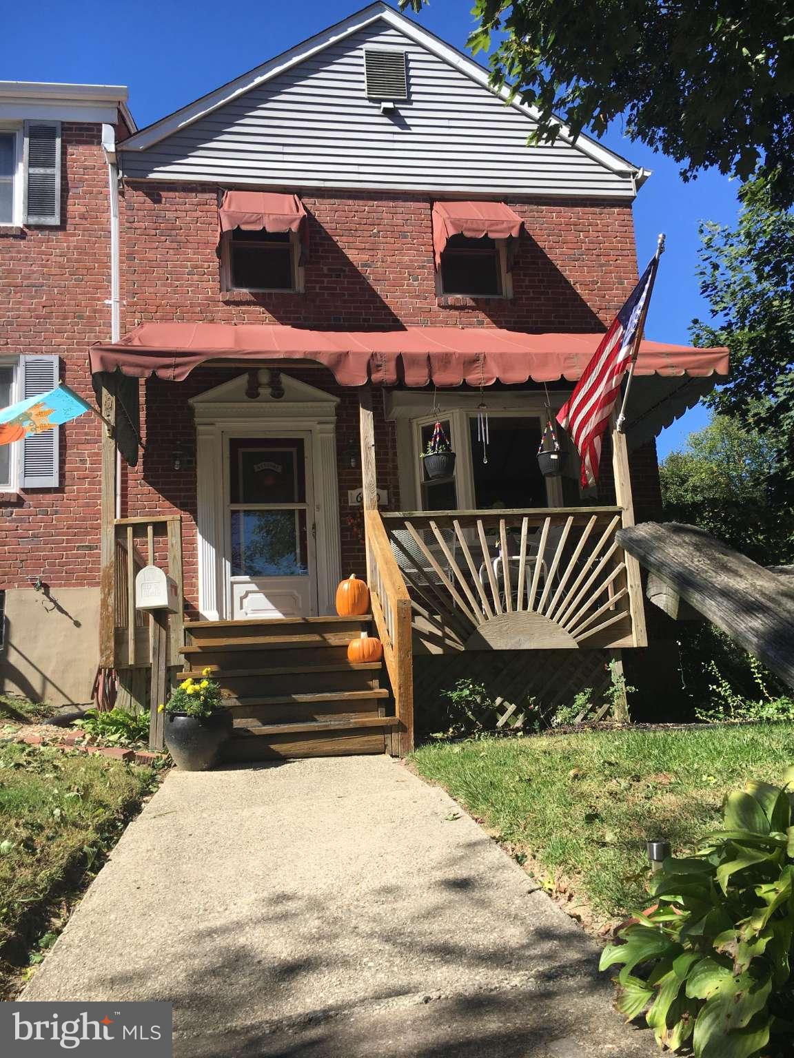 6010 Falkirk Road Baltimore, MD 21239 - Photo 26 of 30 a front view of a house with garden