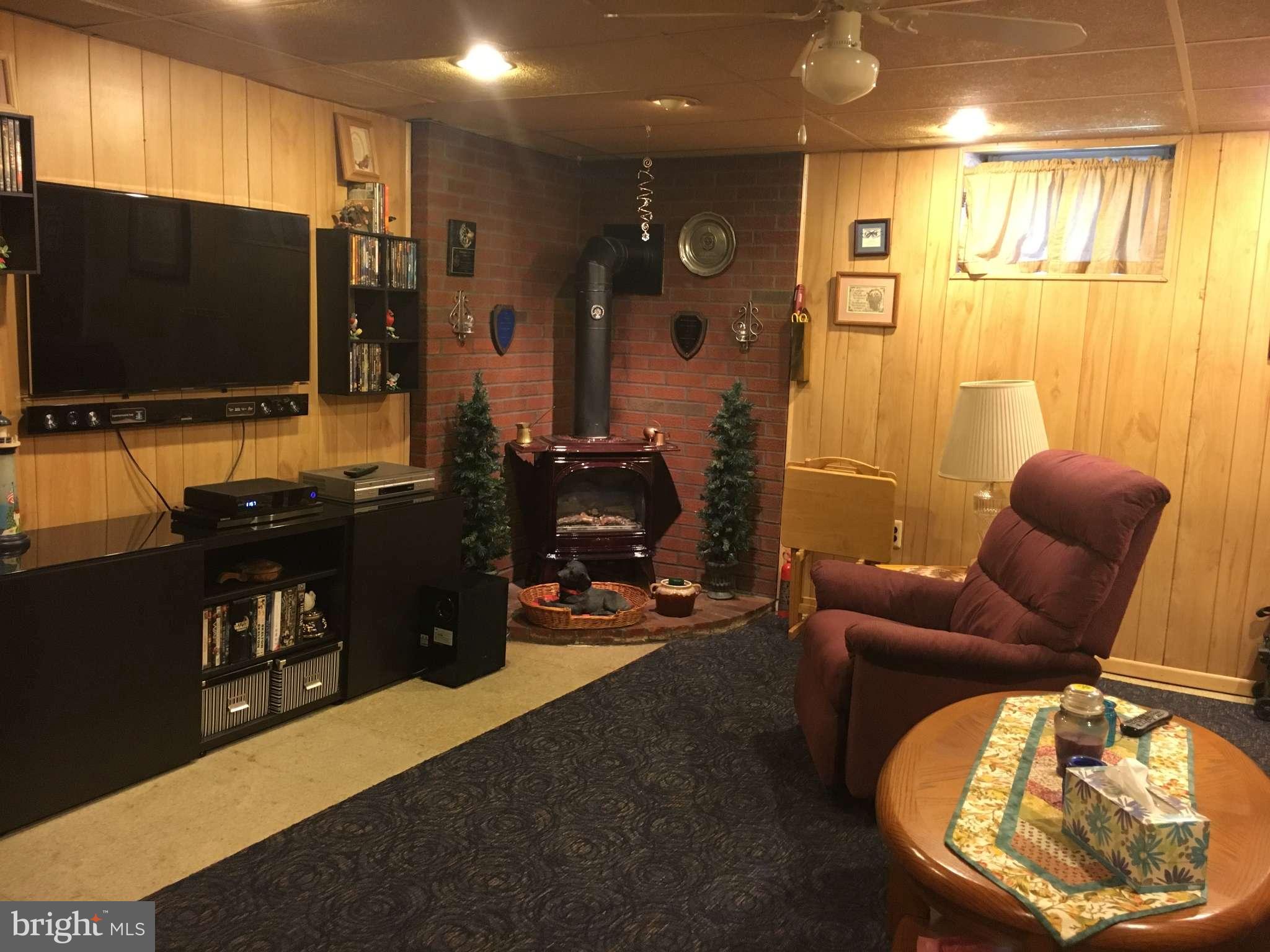 6010 Falkirk Road Baltimore, MD 21239 - Photo 28 of 30 a living room with furniture and a flat screen tv