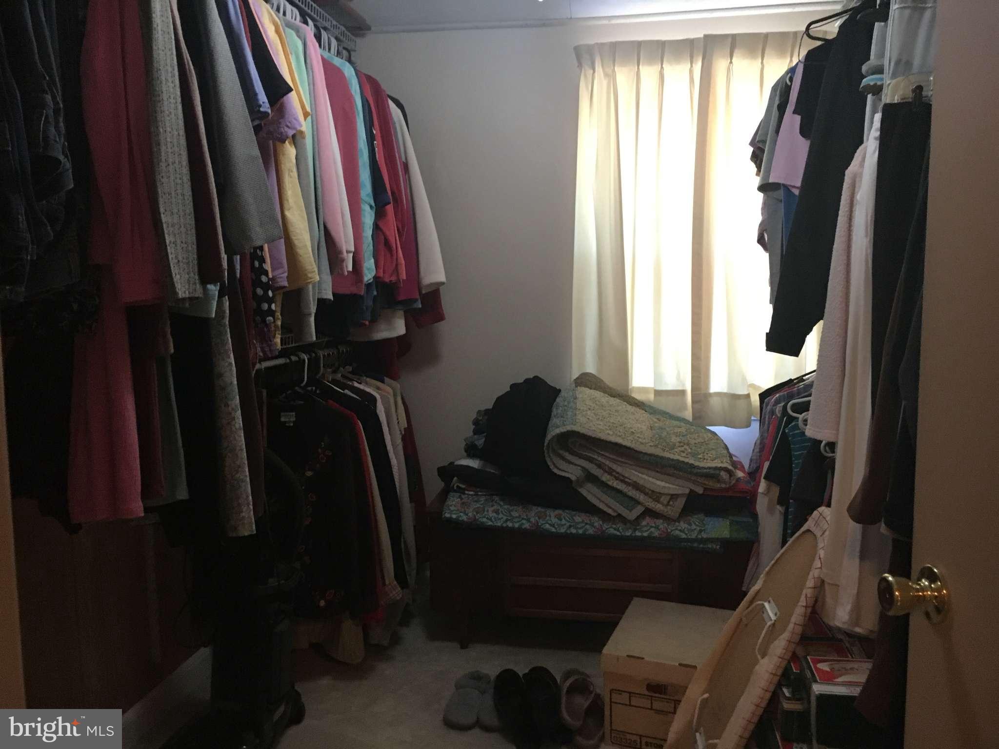 6010 Falkirk Road Baltimore, MD 21239 - Photo 10 of 30 a view of walk in closet with clothes and shoes