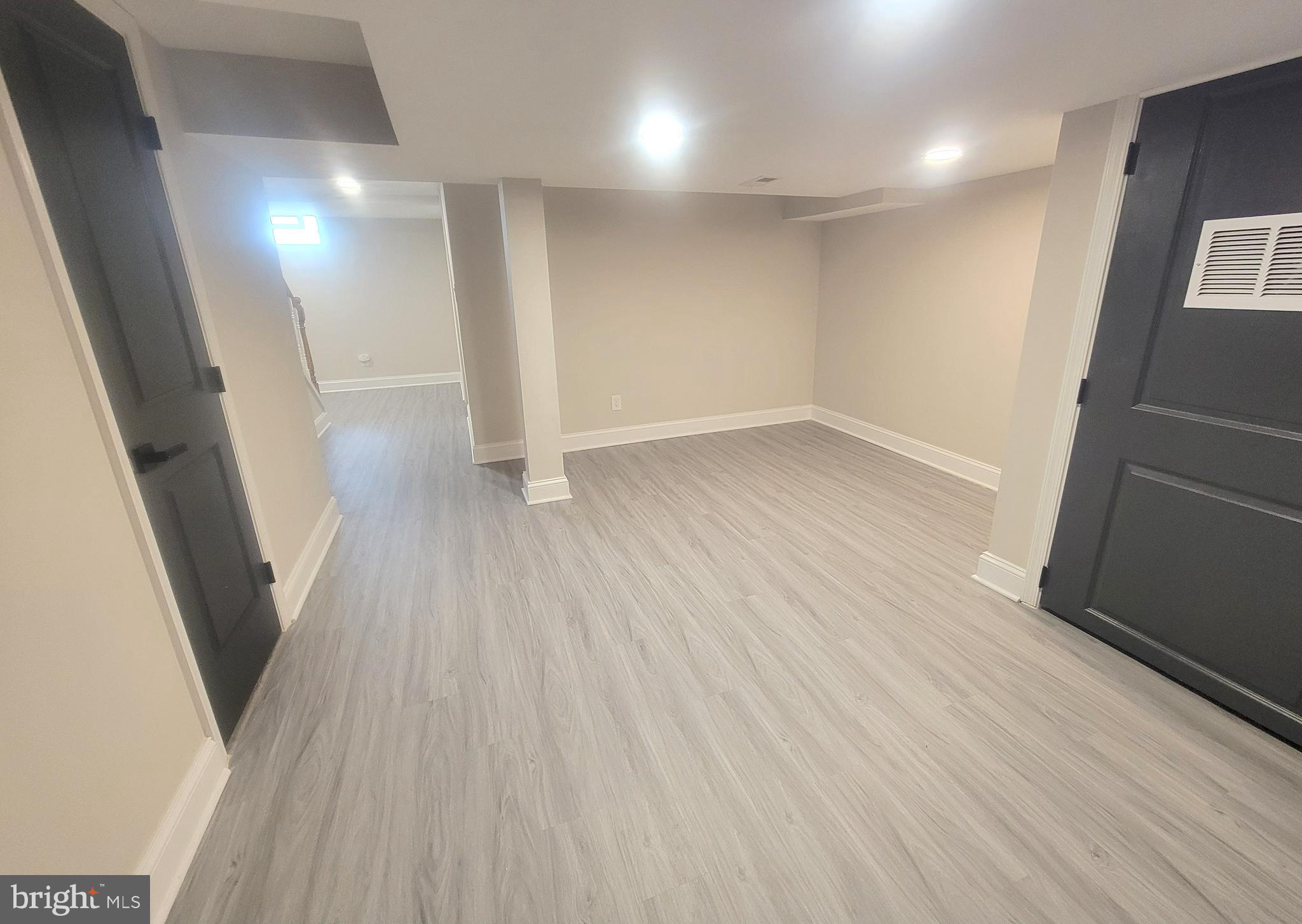 202 Edgewood Street Baltimore, MD 21229 - Photo 22 of 29 wooden floor in an empty room with a window