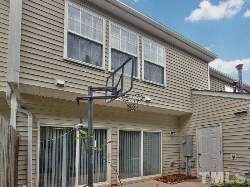 8523 Bright Loop Raleigh, NC 27613 - Photo 20 of 23 a view of a house with wooden fence